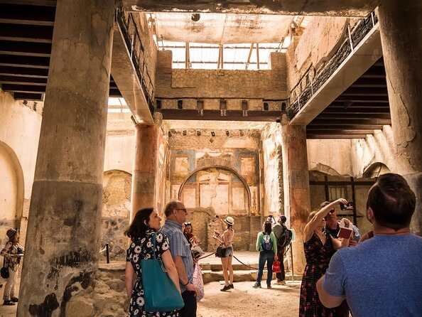 Pompeii and Herculaneum Private Walking Tour with an Archaeologist - Private archaeologist pacing across two ruined cities